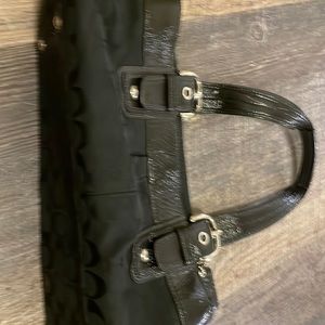 Coach satchel style bag, black with patent trim and straps. Like new, hang tag.